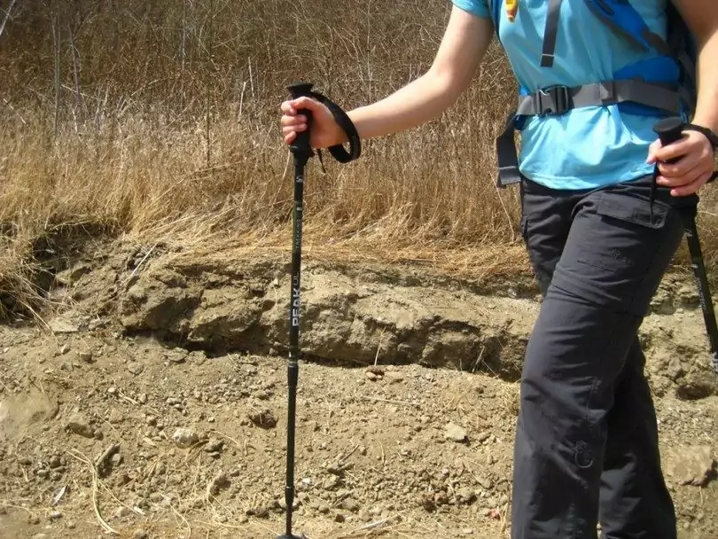 Hiking lady trekking poles