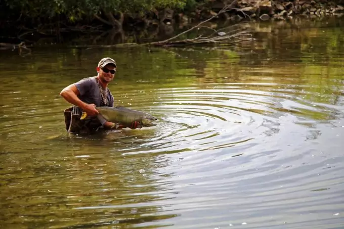 Man with Fish in the River