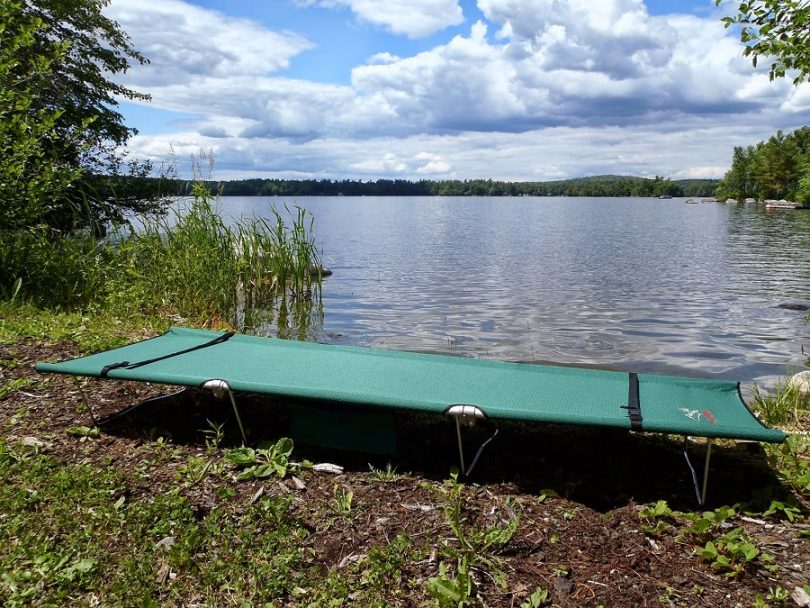 Camping cot near water